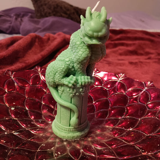 Green dragon on statue candle