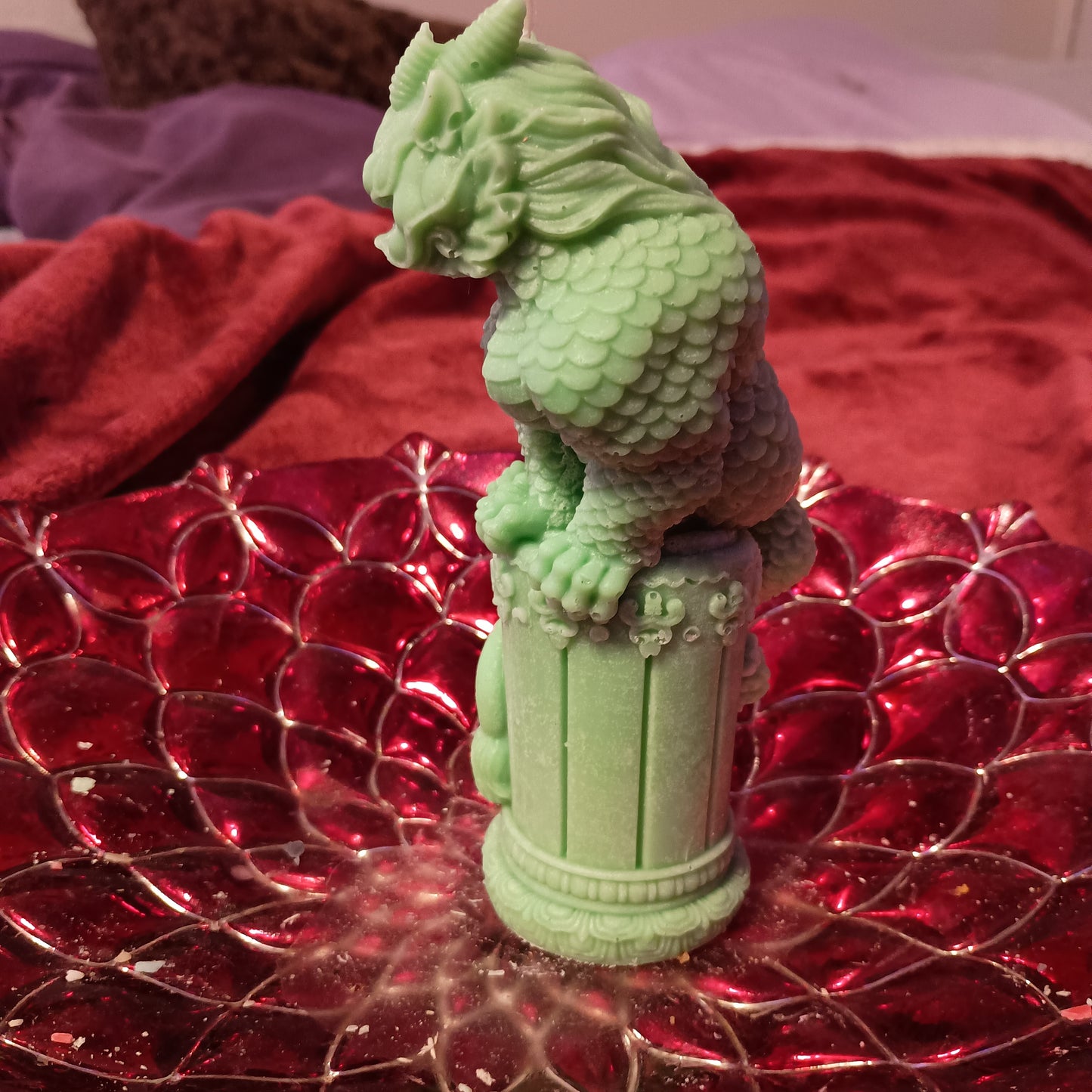 Green dragon on statue candle