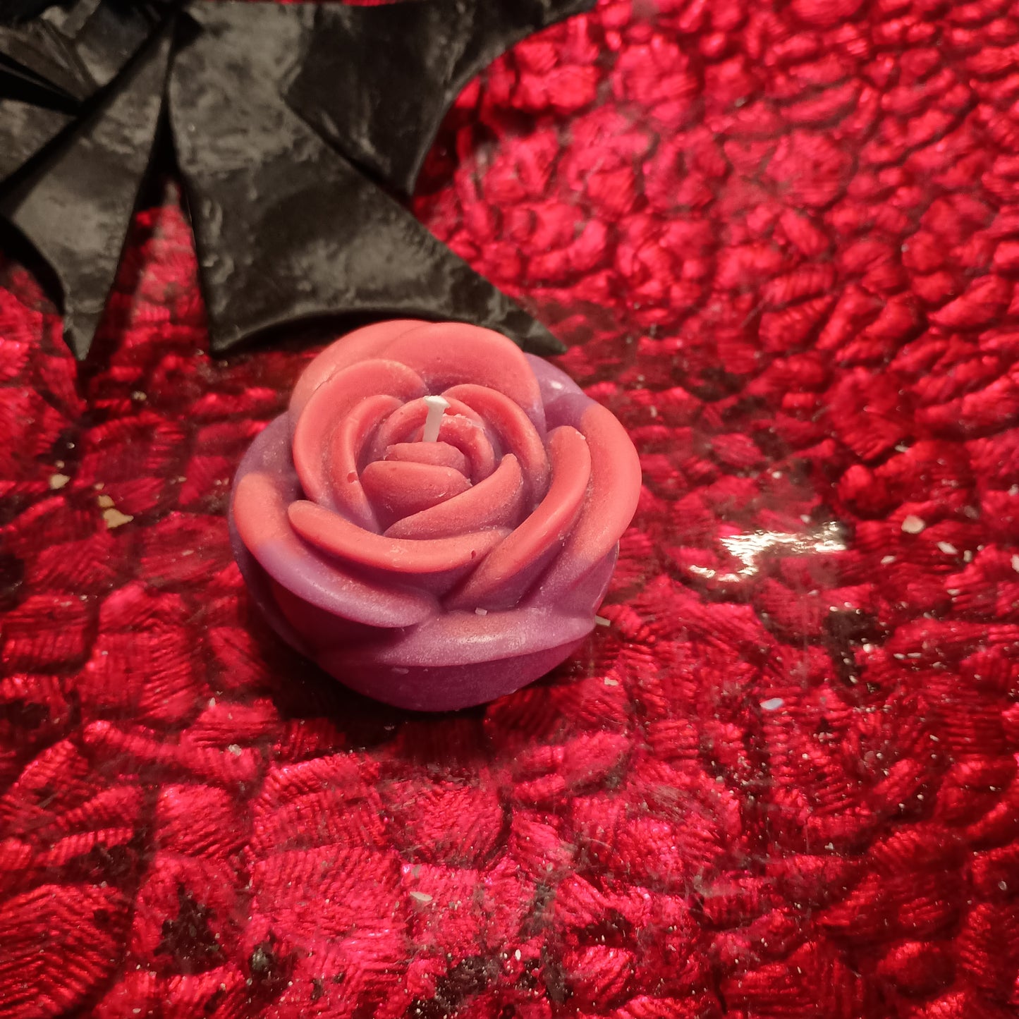 Red and purple flower candle