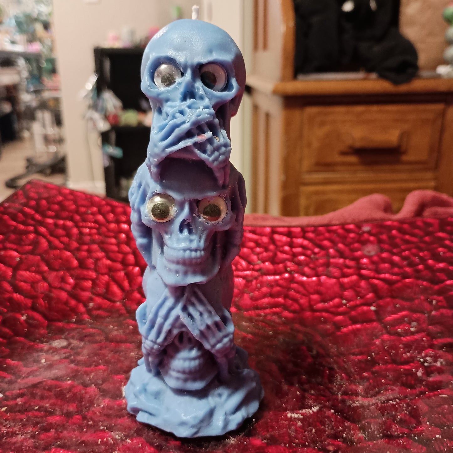 Blue tower of skulls with googly eyes