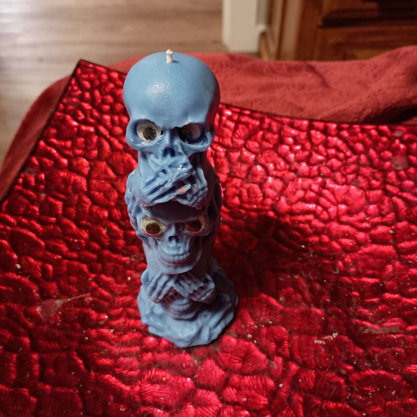 Blue tower of skulls with googly eyes