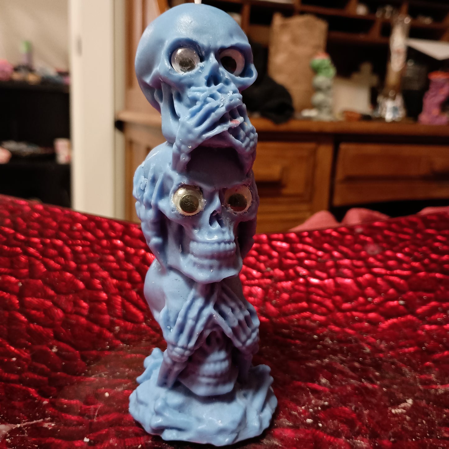 Blue tower of skulls with googly eyes