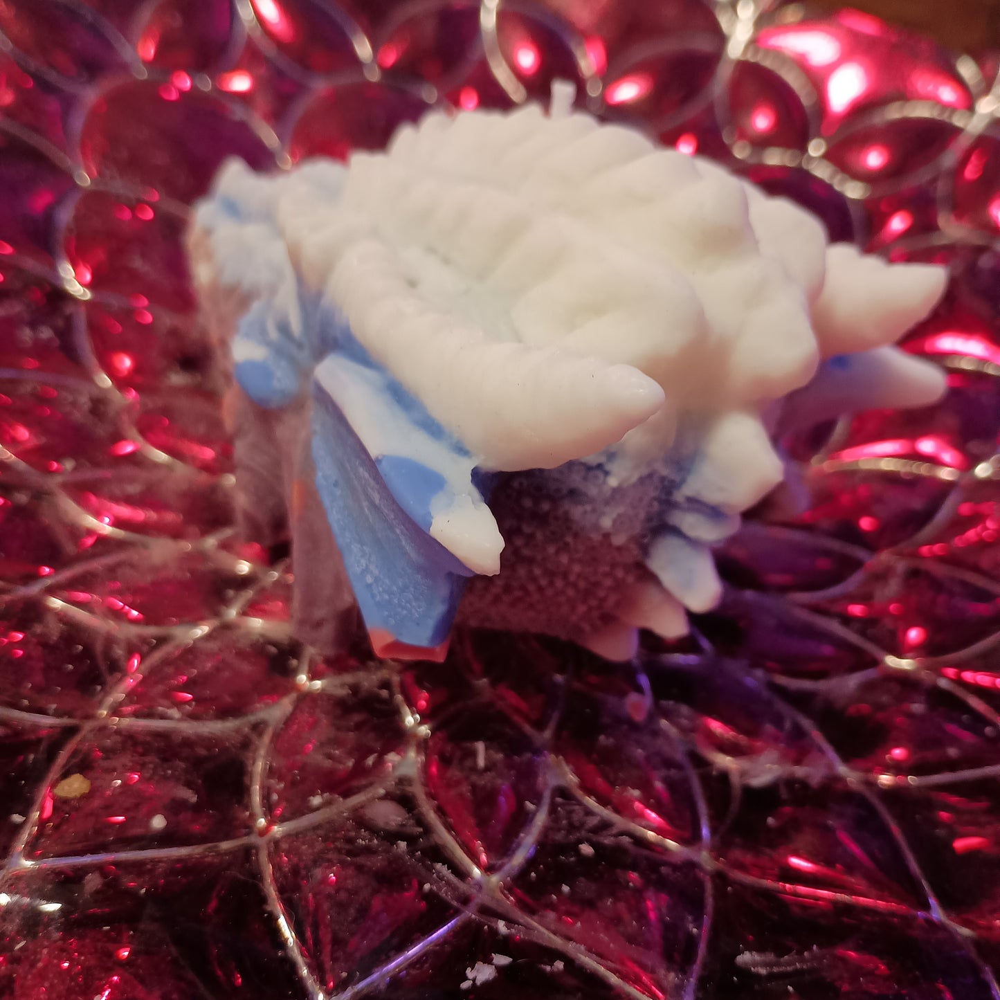 Red white and blue dragons head candle