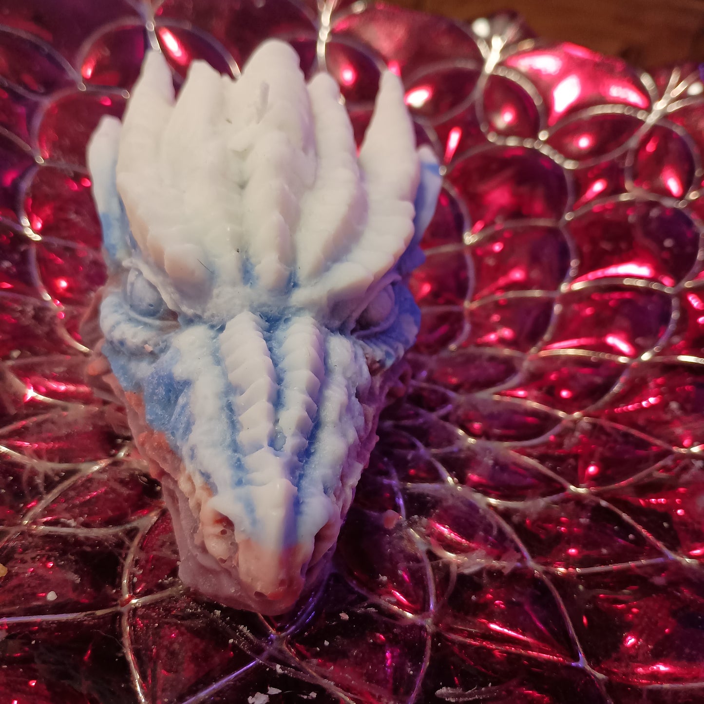 Red white and blue dragons head candle