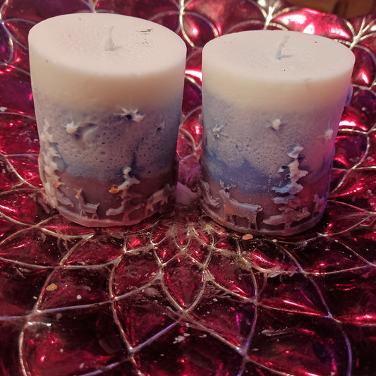 Pair of Red white and blue holiday piller candles