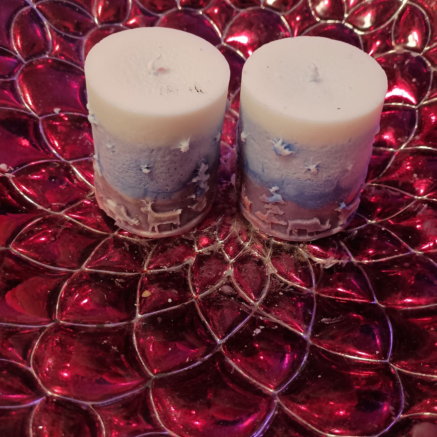 Pair of Red white and blue holiday piller candles