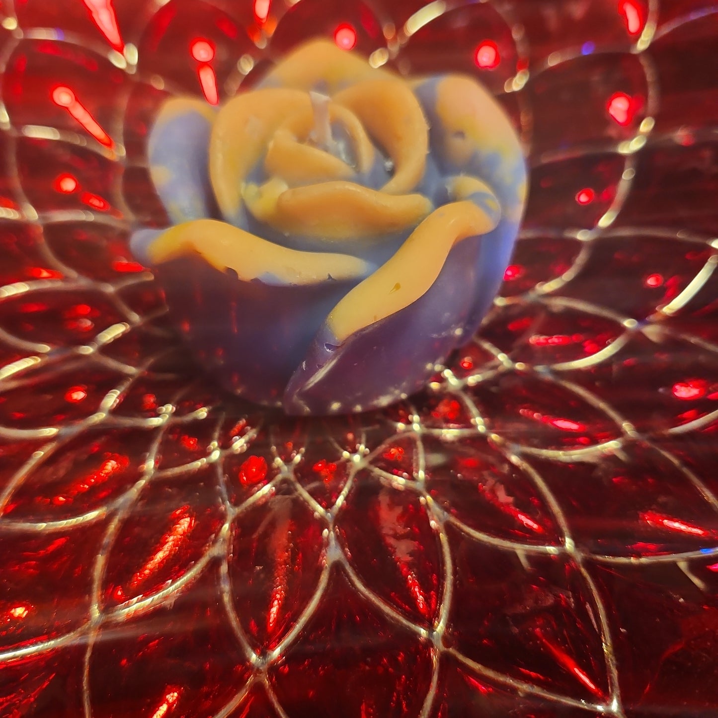 Blue and orange flower candle