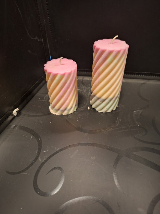 Pair of blacklight designed piller candles scented