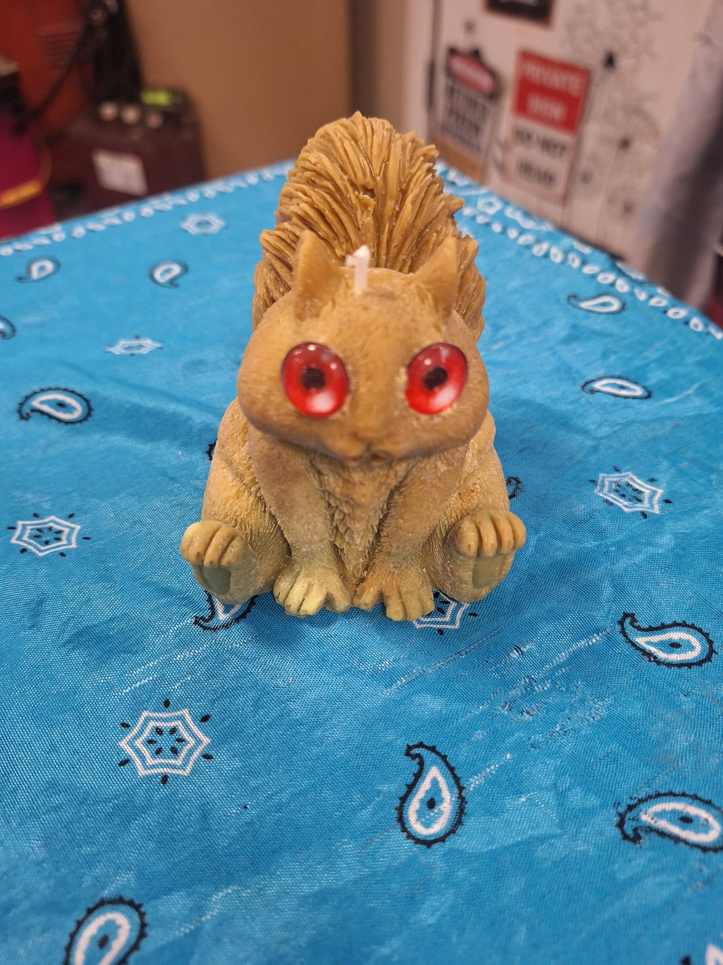 Squirrel candle with googley eyes