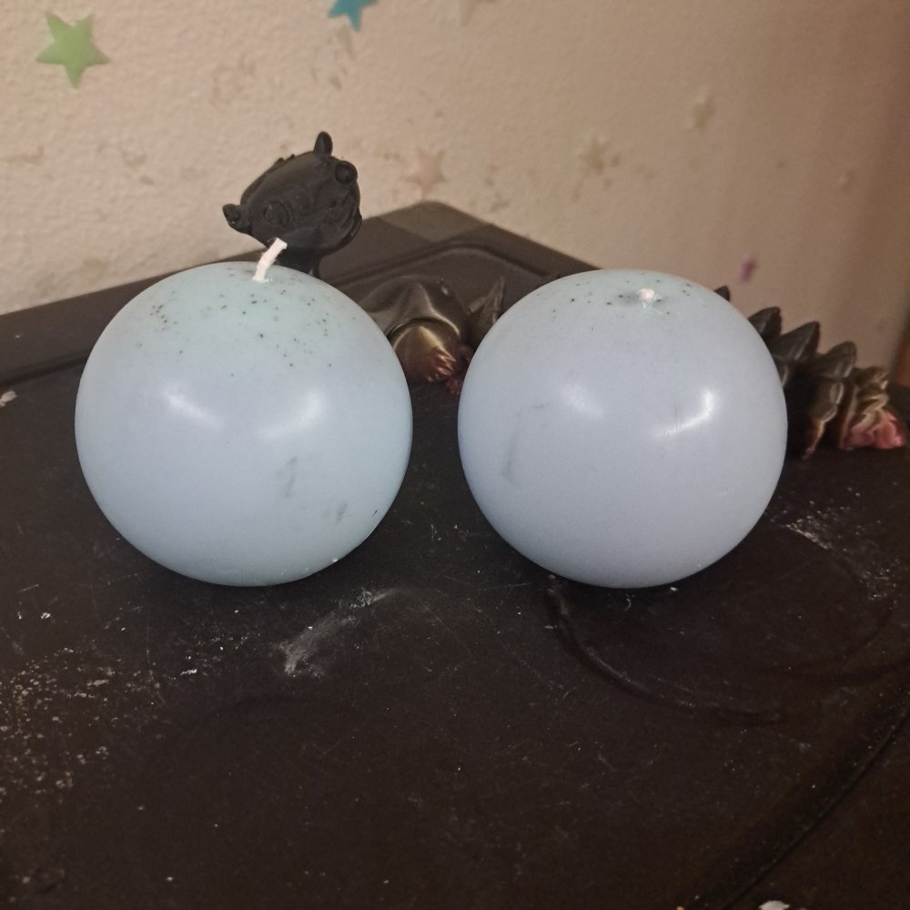 Pair of blue/purple medium orb scented candles25