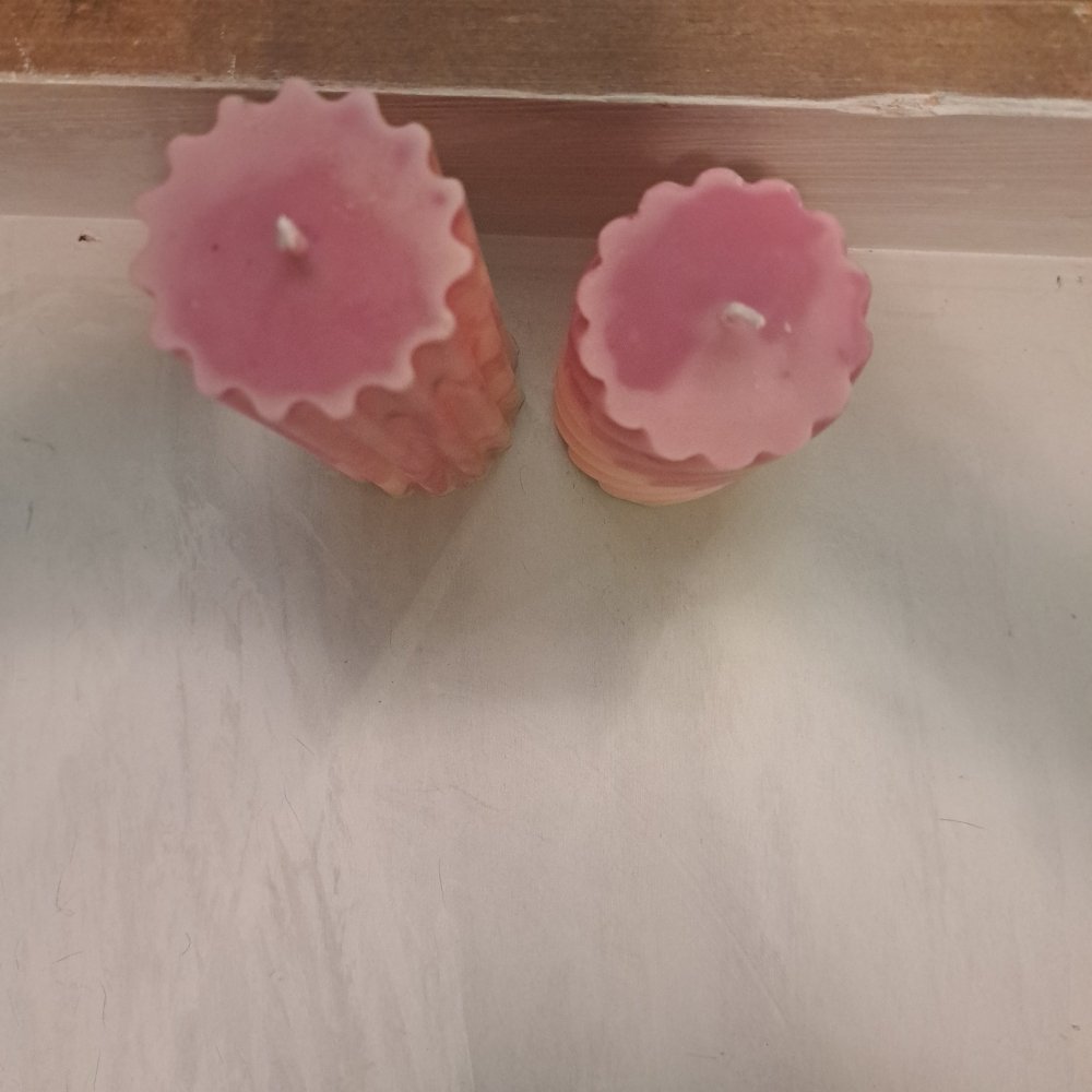 Pair of orange and pink designed scented piller candles14