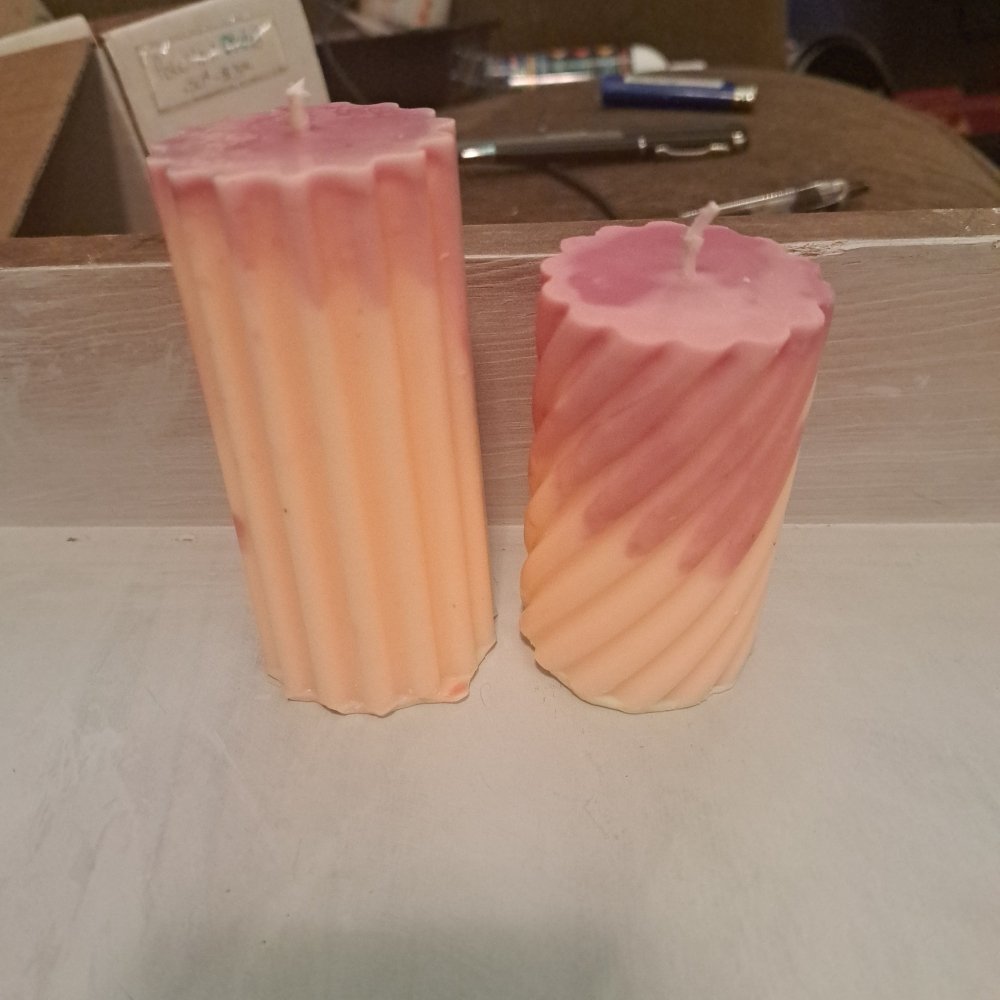 Pair of orange and pink designed scented piller candles14