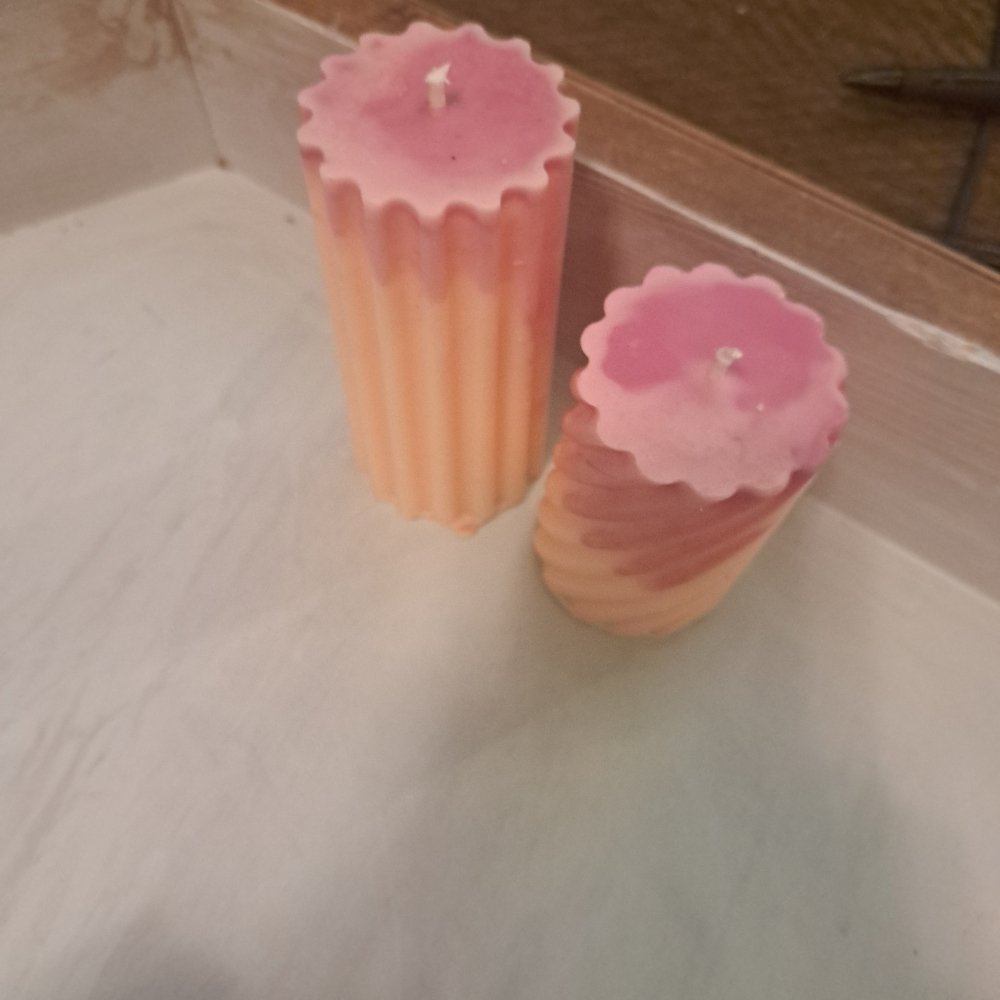 Pair of orange and pink designed scented piller candles14