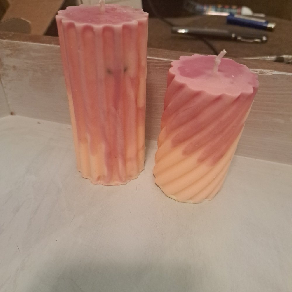 Pair of orange and pink designed scented piller candles14