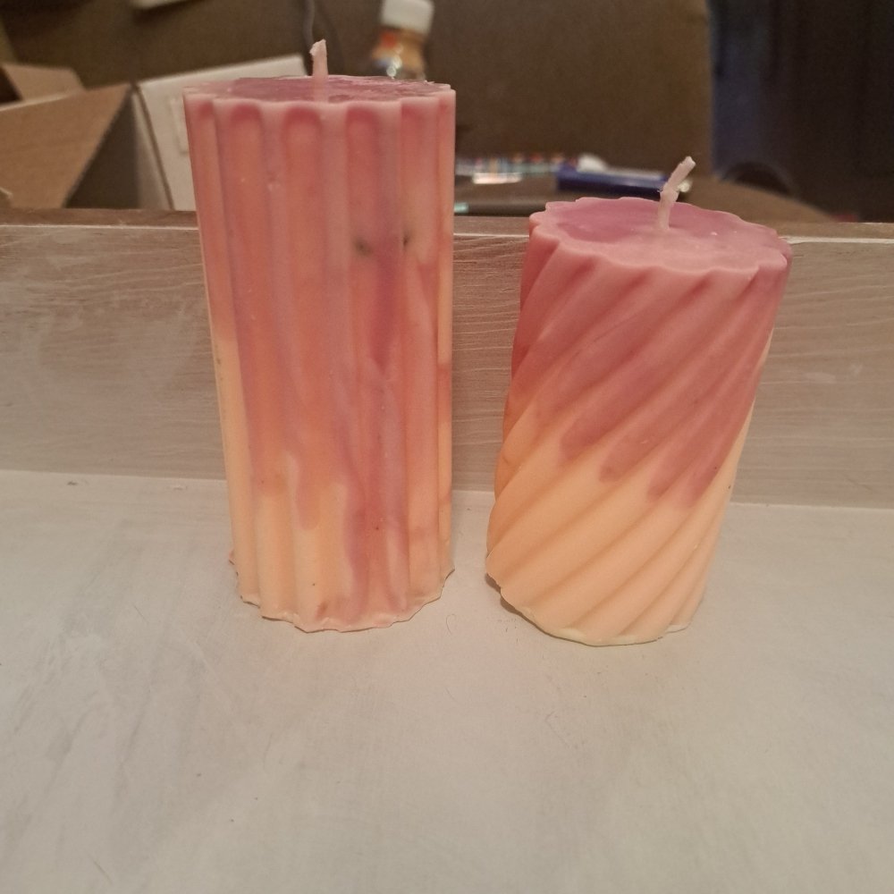 Pair of orange and pink designed scented piller candles14