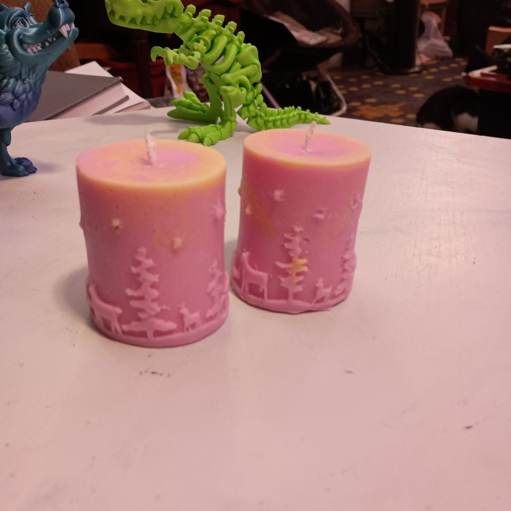 Pair of pink and yellow Christmas themed scented piller candles14