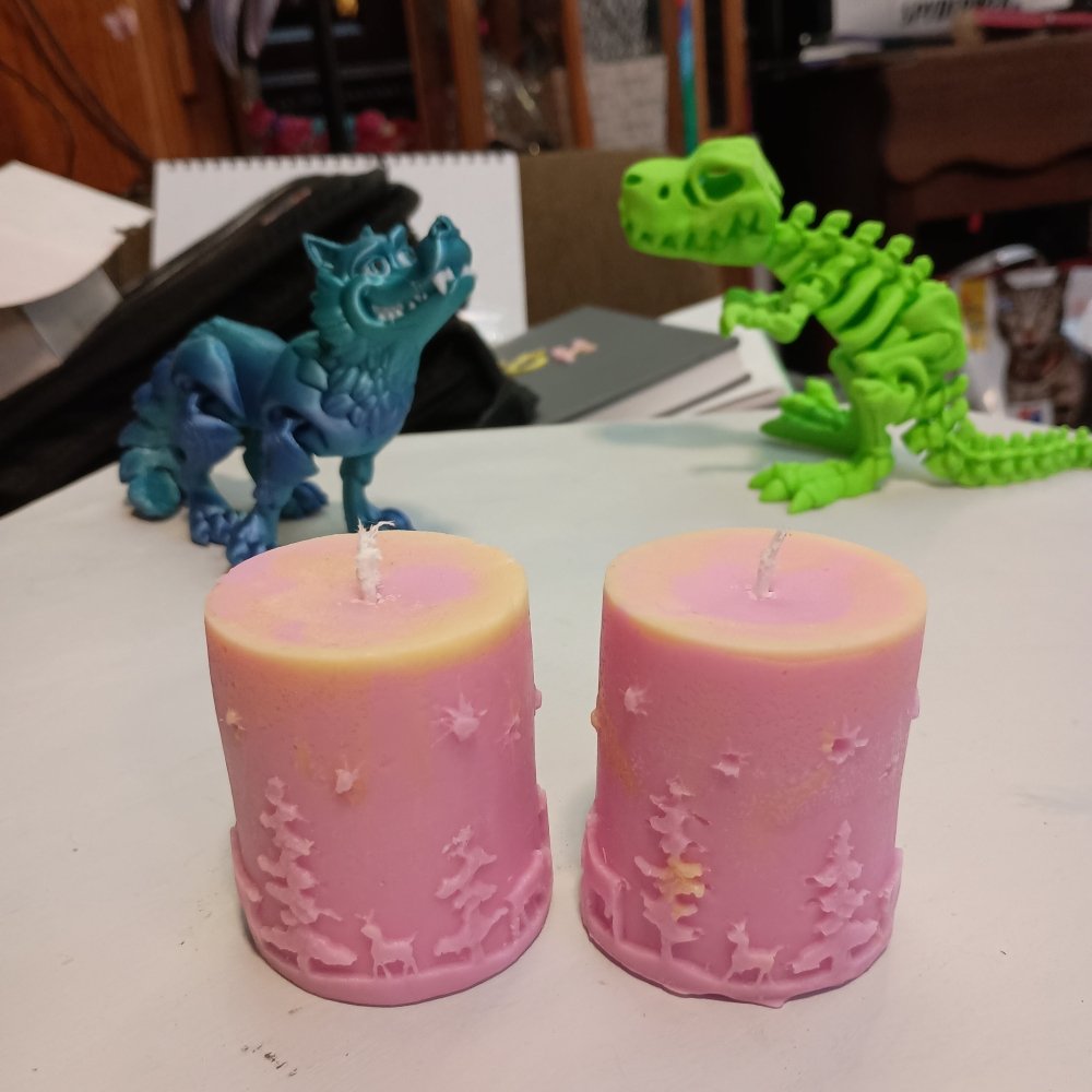 Pair of pink and yellow Christmas themed scented piller candles14