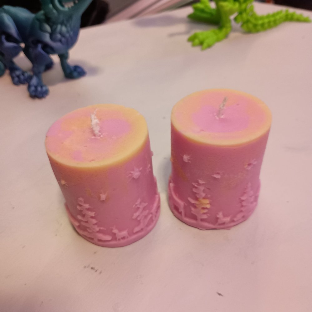 Pair of pink and yellow Christmas themed scented piller candles14