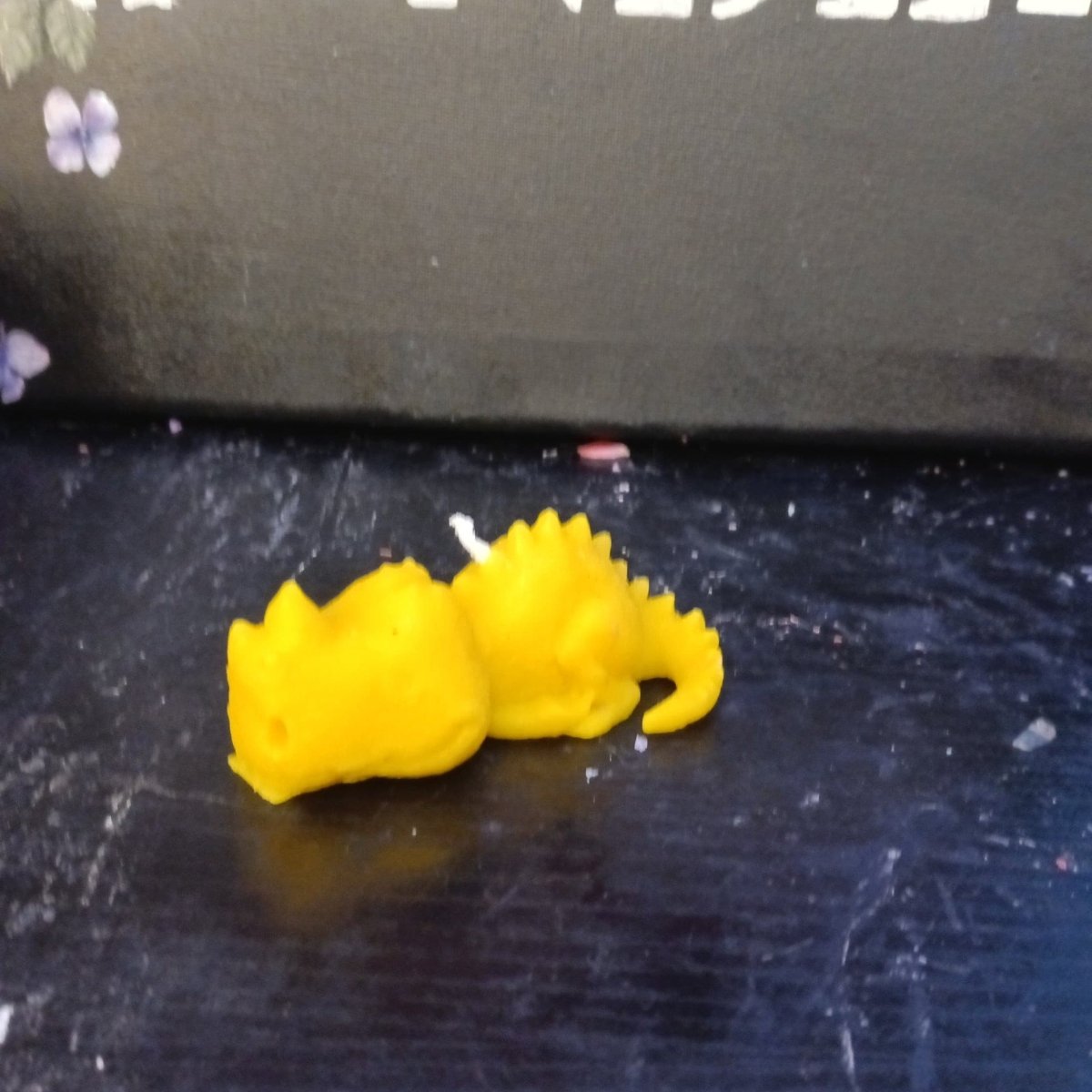 YELLOW sleeping dino scented candle6